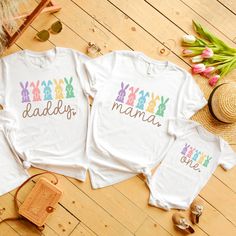 "🐇 Celebrate your little bunny's first hop into life with our \"Some Bunny is One\" family birthday shirts, perfect for capturing those unforgettable Easter moments together.  Don't miss out on making this birthday and Easter celebration memorable - hop over to our shop and get your family outfitted in the cutest Easter attire today! 👕 PRODUCT INFO The Bella + Canvas shirts are super soft and comfy! These t-shirts are made of light fabric and have ribbed knit collars to bolster shaping. They are extremely durable, and will withstand years of repeat washing and wearing. Shoulders, sleeves, and hems have taping for better fit over time. ✏️ DESIGN Designs are printed onto the shirt using Direct to Garment (DTG), which means the ink is laid directly into the fabric resulting in a bright, ful Playful Multicolor T-shirt For First Birthday, Playful White T-shirt For Father's Day, Cute White T-shirt For Family Events, White Cute T-shirt For Family Events, First Birthday Multicolor Graphic T-shirt, Easter-themed White Tops With Letter Print, White Letter Print Top For Easter, Easter White Letter Print Tops, Playful White T-shirt For Easter