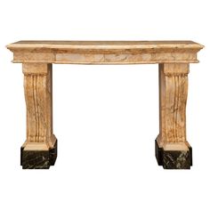 an antique marble fireplace mantel with two columns on either side and one column at the top