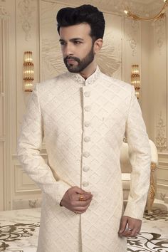 Looking for an elegant yet unique look on your wedding day? Look no further than our Mens Sherwani R14-S54! This thread-embroidered sherwani will make you stand out as the groom while showcasing a touch of quirkiness and style. Designer Off-white Bandhgala For Eid, Designer Off-white Bandhgala With Resham Embroidery, Formal Off White Kurta With Cutdana, Formal Off-white Kurta With Cutdana, Off White Naqshi Bandhgala, Off White Formal Sherwani With Resham Embroidery, White Nehru Jacket With Cutdana For Reception, Formal Off White Traditional Wear With Chikankari Embroidery, Formal Off-white Traditional Wear With Chikankari Embroidery