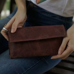 With so many ladies' wallets on the market, it's difficult to decide which one best fits your needs. We are here to help and believe we have some great options to consider. Our Handmade Brown Women’s Wallet is a comfortable way to carry your necessities. There are two bill compartments, 12 storage slots for cards and two open space compartments. The interior zipper pocket is perfect for those small items and loose change. Everything closes easily with a magnetic closure. Beyond its great appeara Women’s Wallet, Wallets For Girls, Leather Camera Strap, Womens Wallet, Brown Leather Wallet, Loose Change, Handmade Leather Wallet, Personalized Wallet, Leather Coin Purse