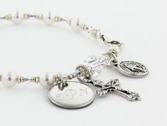 "A personalized bridesmaid gift to say \"Thank You So Much.\" Each bracelet can have it's own personalized disc! It can represent a one decade rosary or just be a very stylish bracelet (I can remove the crucifix and medal). It comes with a Crucifix and a Miraculous Medal dangling near the clasp. It is available with or without an Engraved Disc and it comes with your choice of a Gift Message that is elegantly boxed for simple gift giving. The ornate and delicate Rosary Bracelet is handcrafted wit Adjustable Silver Charm Bracelet For Bridesmaid Gift, Adjustable Engraved Name Bracelet For Bridesmaid Gift, Silver Charm Bracelet For Wedding, Adjustable White Jewelry With Engraving Option, Adjustable Silver Jewelry For Bridesmaid, White Sterling Silver Bracelet For Bridesmaid Gift, White Sterling Silver Bracelets For Bridesmaids, White Sterling Silver Crystal Bracelet For Wedding, Adjustable Sterling Silver Crystal Bracelet For Wedding