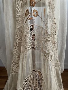 RARE and Beautiful ! Antique 1910s -1920s beige lace curtain with beautiful details, all handworked and hand embroidered with cotton and silk. The color is beige. ✂-----Measurements : length: 100 inches width: 65 inches condition : excellent ( no holes ) Please message me if any additional measurements are needed or if you have any questions about this item. I can usually respond within 24 hours. Shipping Is Avaliable Worldwide. Every item is carefully shipped Priority via Air Mail - shipping ta Bohemian Cotton Lace Patchwork, Bohemian Cream Lace For Summer, Cream Bohemian Summer Lace, Cream Bohemian Lace With Lace Trim, Bohemian Cream Lace With Lace Trim, Bohemian Beige Crochet Lace, Beige Bohemian Crochet Lace, Bohemian Cream Crochet Lace, Vintage Cotton Lace For Wedding