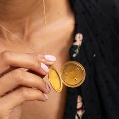 The Story A striking antique piece from the Victorian era. Created in 14 karat yellow gold, a raised mythical lion's head is the main feature of this round locket. Formed with lots of expression, two small rubies are set as the eyes with a 0.10 carat Old Mine Cut diamond set within the lion's mouth. The locket shows its age in the best possible way with the rich patina making the raised work pop and gold glow. At 1.66" tall with its bale, it's a substantial size. It holds two round photos and is Gold Medallion Locket Necklace Stamped 14k, Victorian Round Locket Necklace Stamped 14k, Ceremonial 14k Gold Medallion Jewelry, Antique Gold Round Jewelry With Coin Pendant, Luxury Round Locket Necklace For Gift, Antique 14k Yellow Gold Locket Necklace, Victorian 14k Stamped Round Locket Necklace, Heirloom Yellow Gold Medallion Locket Necklace, Gold Round Locket Necklace Tarnish Resistant