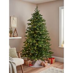 a christmas tree with lights in a living room