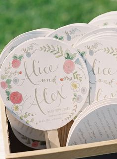 there are many paper plates in the box with flowers and leaves on them that say alice and jack