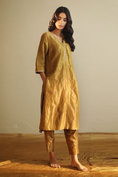 Antique gold kurta with zardozi placement embroidery and notched neckline. Paired with pant.
Components:2
Neckline:Notched
Sleeve Length:Three quarter
Fabric:Handloom Tissue
Color:Gold
Side pockets - Aza Fashions Tissue Kurta, Lehenga Saree Design, Breathable Clothes, Modest Dresses Casual, Party Suits, Sharara Set, Groom Wear, Kurta With Pants, Fashion App