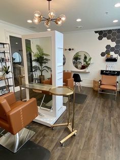 a hair salon with chairs and mirrors