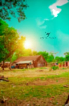 a blurry photo of a rural area with houses and trees in the foreground