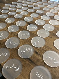 glass plates with names on them sitting on a table