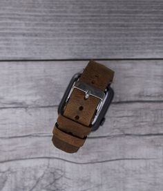 Genuine leather camel brown sport Apple watch band for series 1-6 & SE. This watch strap is medium size and fits 150-190mm wrists. Seven different color options for adapters (Silver, Black, Space Gray, Rose Gold, Yellow Gold, Red and Blue). Adapter color and buckle color will be same. Shipping: Shipping within US takes usually 3 business days via USPS/FedEx, to Europe 1 business day via TNT Express. We normally send the orders in 1 or 2 business days. Customization: We can write messages, na Brown Leather Strap Apple Watch Band, Modern Brown Rectangular Apple Watch Band, Brown Bracelet Strap Apple Watch Band For Everyday Use, Modern Brown Apple Watch Band For Everyday Use, Silver Leather Strap Apple Watch Band For Everyday, Brown Waxed Apple Watch Band For Everyday, Brown Waxed Finish Apple Watch Band For Everyday Use, Modern Brown Watch Accessories With Waxed Finish, Modern Brown Adjustable Watch Accessories