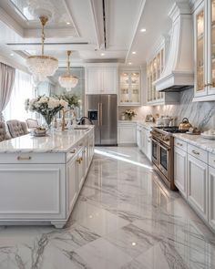 a kitchen with marble floors and white cabinets