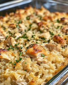 a casserole dish with chicken, rice and parsley