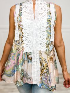 Floral meets playful in our Mock Neck Sleeveless Woven Top. Trim Point Lace Accents add a touch of whimsy. Perfect for adding a pop of fun to any outfit. Fabric- 100% Polyester Chic Spring Tank Top With Lace Patchwork, Feminine Lace Patchwork Tank Top For Spring, Feminine Lace Patchwork Tank Top For Summer, Feminine Summer Tank Top With Lace Patchwork, Chic Lace Patchwork Tank Top For Summer, Sleeveless Tank Top With Lace Patchwork, Feminine Lace Patchwork Tank Top, Feminine Sleeveless Tops With Crochet Trim, Chic Lace Patchwork Tank Top