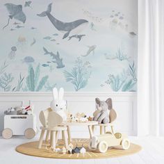 a child's room with an animal themed wallpaper and wooden toys on the floor