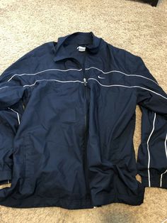 Nike Zip-Up Navy Blue White Stripe Jacket Adult XXL Great Shape The item is in used but great condition, and is from a non-smoking home. Shipping is only $2.99 for single shirt purchased. LOVE to combine shipping. Each additional shirt only .50 cents extra. So check out my new store filled with vintage and hard to find t-shirts. Thanks for viewing! Blue Nike Windbreaker With Pockets, Nike Blue Long Sleeve Windbreaker, Nike Blue Windbreaker With Pockets, Nike Casual Navy Track Jacket, Casual Navy Nike Track Jacket, Nike Blue Track Jacket For Spring, Nike Blue Outerwear For Fall, Blue Nike Outerwear For Fall, Blue Long Sleeve Sport Coat