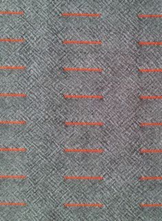 an orange line is on the fabric that has been stitched together with red thread