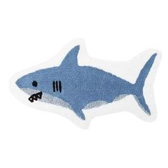 a blue and white shark shaped rug on a white background with the words, i'm