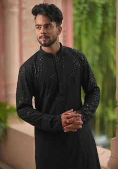 Item: Black Kurta with White Pajama Get into the festive mood with this elegant kurta from Shobitam. Set in an eye-pleasing Black color, this Kurta is perfect for any event that requires ethnic dressing be it an extravagant celebration or a quiet get-together at home. The delicate embroidery deepens the aesthetic value of the kurta. The sequin work highlights the embroidery and brings a festive vibe to this beautiful kurta. The ------- fabric promises oodles of style and comfort. This Kurta in m Wedding Kurta, Wedding Kurta For Men, Black Kurta, White Pajamas, Kurta Pajama, Indian Wear, Salwar Kameez, Pajama Set, Favorite Outfit