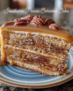 a piece of cake on a plate with pecan caramel icing and pecans