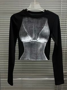 This is perfect for those who are looking for a clothing for a good price. It is fashionable, stylish, and it will look great on anyone who wears it. Do you wanahavit? Black High Stretch Crew Neck T-shirt, Trendy High Stretch Long Sleeve T-shirt, Fitted Crew Neck Top With Graphic Print, Fitted Long Sleeve Crop Top With Graphic Print, Black High Stretch Long Sleeve Tops, Trendy Black Tops With Graphic Print, Fitted Screen Print Tops For Spring, Edgy Fitted Long Sleeve T-shirt, Spring Stretch Top With Screen Print