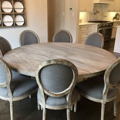 a dining room table with chairs around it