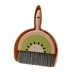 a close up of a brush with a green and pink design on it's head