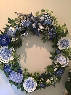 a wreath with blue and white plates on it