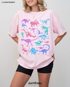 This Unisex garment-dyed t-shirt features a grunge set of dinosaur illustrations in a pastel color palette. It is the perfect gift for dinosaur lovers, present / future paleontologists, and more! Make sure to check out the other garment options below :) » O P T I O N S « ‣ Crewneck: https://www.etsy.com/listing/1221165814 » A B O U T « ‣ This item is made to order using direct-to-garment (DTG) printing technology. This digital process involves the printer inks being jetted or sprayed onto the te 90s Grunge Clothing, Indie Graphic Tees, Dinosaur Tshirt, Universal Parks, Pastel Goth Outfits, Cute Dino, Goth Clothes, Grunge Clothing, Dinosaur Illustration