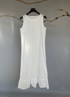 "100% Premium quality cotton slip, cling free, soft, comfortable and no itch. An exquisite accessory for your wardrobe, this soft and light slip can be worn to layer under any sheer caftans, tunics, dresses (as shown in the picture), traveling, and just as a lovely night dress at home. -100% cotton -Ankle length -Eyelet hem -Slightly A-line shaped -The last two pictures are for reference of the slip's length underneath a maxi dress. Please provide your full bust measurement ( measured around the Fitted Sleeveless Cotton Slip Dress, Fitted Cotton Slip Dress For Spring, Casual Slip Dress For Spring Daywear, Casual Spring Daywear Slip Dress, Fitted Cotton Slip Dress For Summer, Sleeveless Cotton Slip Dress For Spring, Casual Sleeveless Slip Dress For Sleep, Summer Sleeveless Cotton Slip Dress, Cotton Spaghetti Strap Slip Dress For Daywear