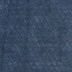 an upholstered blue fabric with diamond shapes