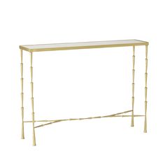 a gold metal and glass console table with bamboo poles on the top, against a white background