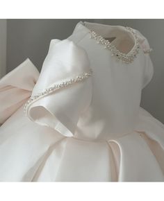 Buy couture ivory satin ruffled jeweled neckline flower girl dress with short sleeves at wholesale price online. Free shipping and pro custom service since 2009. Baby Satin Dress, Satin Baby Dress, Ruffle Neckline Dress, Toddler Birthday Dress, Girls Dresses Diy, First Birthday Dresses, Baby Dress Design