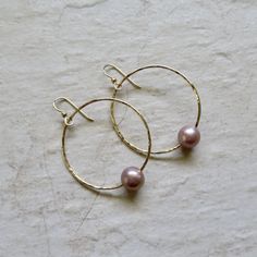 "Gold Hoop Pearl Earrings~ These elegant gold hoop earrings with pink/lavender Edison pearls will look great for any occasion. Hammered and polished to a beautiful shine. Hoops are approx. 1.5\" Model wearing similar designs Shop~ http://www.etsy.com/shop/HanaMauiCreations?ref=pr_shop_more International buyers please read our shipping policies before ordering~ POLICIES~ https://www.etsy.com/shop/HanaMauiCreations/policy?ref=shopinfo_policies_leftnav" Hoop Pearl Earrings, Edison Pearls, Hammered Hoop Earrings, Pink Lavender, June Birthstone, Earrings Pink, Maui Hawaii, Jewelry Wedding, June Birth Stone