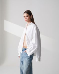 Spread collar Button closure Four Sleeves Back sleeves with single-button cuffs Front sleeves with gathered cuffs 100% Cotton