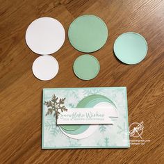 the paper is cut out and placed on top of the card, along with some other crafting supplies