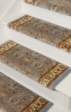 carpeted stair treads with rugs on them