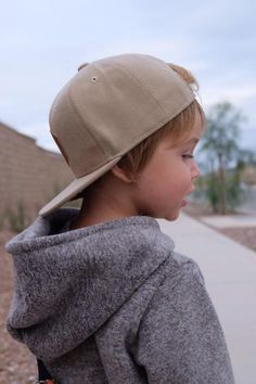 These snapback caps are perfect for all your cool little dudes!Our hip Lausbub logo is made from faux leather and sewn onto the caps.Whether you want to keep your long haired boy's hair in check, provide some shade for those hot summer days, or are just looking for a cool boy accessory for your little guy - our snapback caps are sure to please! Our stylish hexagon faux leather logo makes our caps unique but yet easy to pair with any outfit.Details: - Faux leather Lausbub Logo Patch- High quality Casual Baseball Cap With Leather Patch, Adjustable Flat Bill Baseball Cap, Casual Snapback Baseball Cap With Leather Patch, Casual Brown Baseball Cap With Letter Patch, Casual Leather Patch Snapback Baseball Cap, Everyday Brown Snapback Hat With Flat Bill, Adjustable Casual Baseball Cap With Leather Patch, Casual Adjustable Baseball Cap With Leather Patch, Casual Adjustable Snapback Hat With Letter Patch