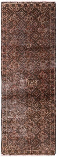 an old rug with brown and tan colors