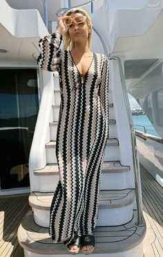 Beach bound with drink in hand in this groovy neutral coverup. The Vacay Coverup is a crochet maxi with long sleeves and a sweet tie front. Throw her on over a bikini with strappy sandals and straw hat. Chic Long Sleeve Poolside Cover-up, Beachy Fitted Long Sleeve Cover-up, Fitted Beachy Long Sleeve Cover-up, Chic Long Sleeve Cover-up For Beach Party, Chic Maxi Cover-up For Day Out, Chic Maxi Length Cover-up For Day Out, Chic Maxi Length Day Out Cover-up, Chic Fitted Vacation Cover-up, Chic Fitted Cover-up For Poolside