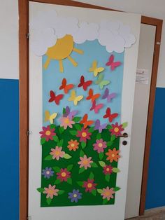 a door decorated with paper flowers and butterflies