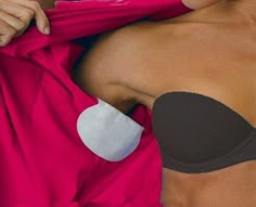 an image of a woman with breast pad on her chest and the caption says, it is a party liner to block swaddled stains for sweaters, sweats, etc