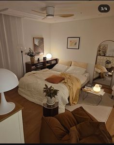 a bed room with a neatly made bed and two lamps