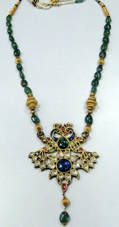 Vintage Antique 22 ct gold Peacock necklace kundan meena polki diamond necklace A genuine antique rare piece of jewel comes from the houses of Mewar,made with high calibre kundan polkee (old uncut diamonds) and genuine natural gemstones necklace (Kundan Meena choker). A beautiful peacock set with genuine gemstone absolute breathtaking piece in very good condition strung with emerald and gold beads fully handmade one of a type with very elobrate enamel work at the back. Could be worn either side. 22k Gold Kundan Pendant Necklace For Diwali, Antique 22k Gold Chandbali Jewelry, Antique 22k Gold Meenakari Jewelry, Ornate Hand Set Chandbali Kundan Necklace, Ornate Yellow Gold Kundan Necklace For Festivals, Ornate Kundan Necklace In Yellow Gold For Festivals, Ornate Chandbali Kundan Necklace Hand Set, Elegant Kundan Temple Necklace With Peacock Design, Antique Yellow Gold Jewelry With Meenakari