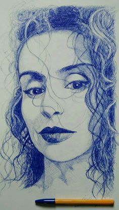 a pencil drawing of a woman's face with curly hair and blue eyes on paper