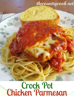 a plate of spaghetti with bread on the side and an advertisement for crock pot chicken parmesan