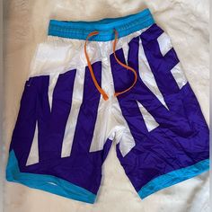 Men’s Drawstring Basketball Shorts Nike Casual Nylon Swim Trunks, Nike Casual Swim Trunks In Nylon, Nike Beachwear Bottoms For Summer, Nike Summer Beachwear Bottoms, White Nylon Shorts For Streetwear, White Drawstring Shorts For Streetwear, White 90s Style Shorts For Summer, White 90s Style Summer Shorts, Nike Nylon Beach Bottoms