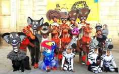 a group of people in animal costumes standing next to each other