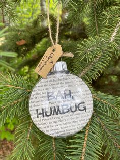 a bah humbug ornament hanging from a christmas tree