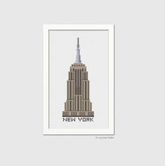 the empire building in new york, ny is shown on a gray background with white frame