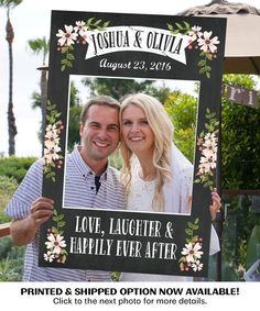 a man and woman holding up a sign